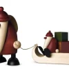 Weihnachtsman mit Geschenkeschlitten und Kind